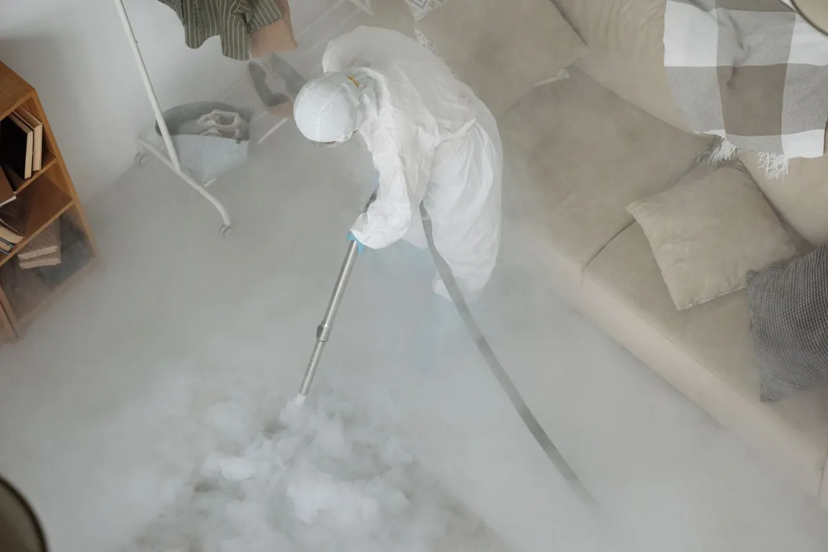 Biohazard cleanup technician in protective equipment, West Hills, PA